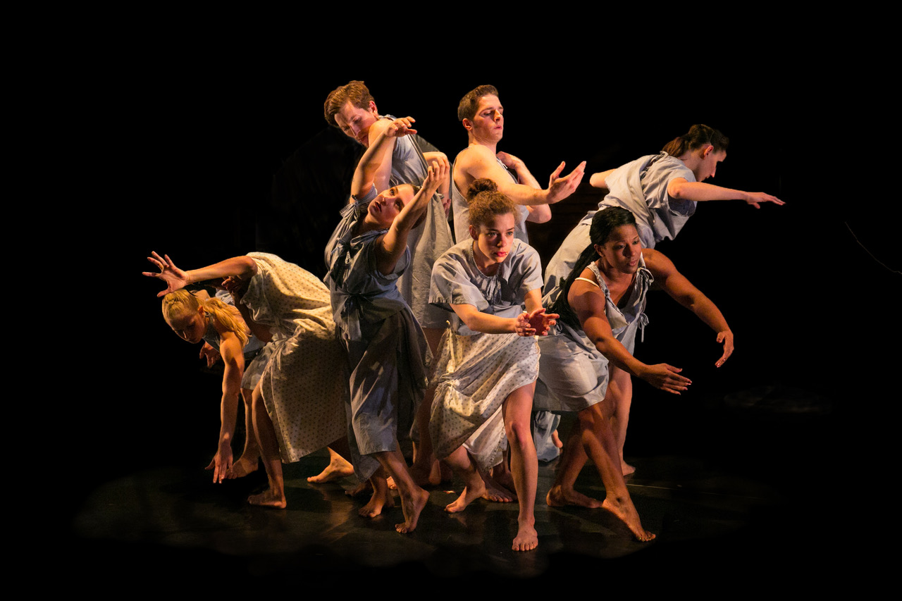 A group of dancers radiating out from the center of their clump